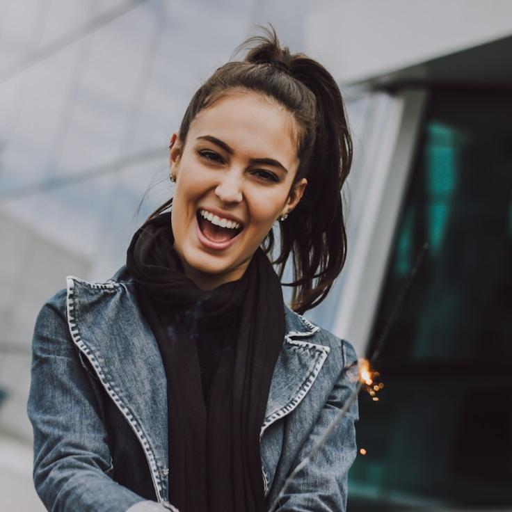 Kaveri Mehta, Lead Design Curator at Quarry Sail Fog, reviewing corporate floral arrangements